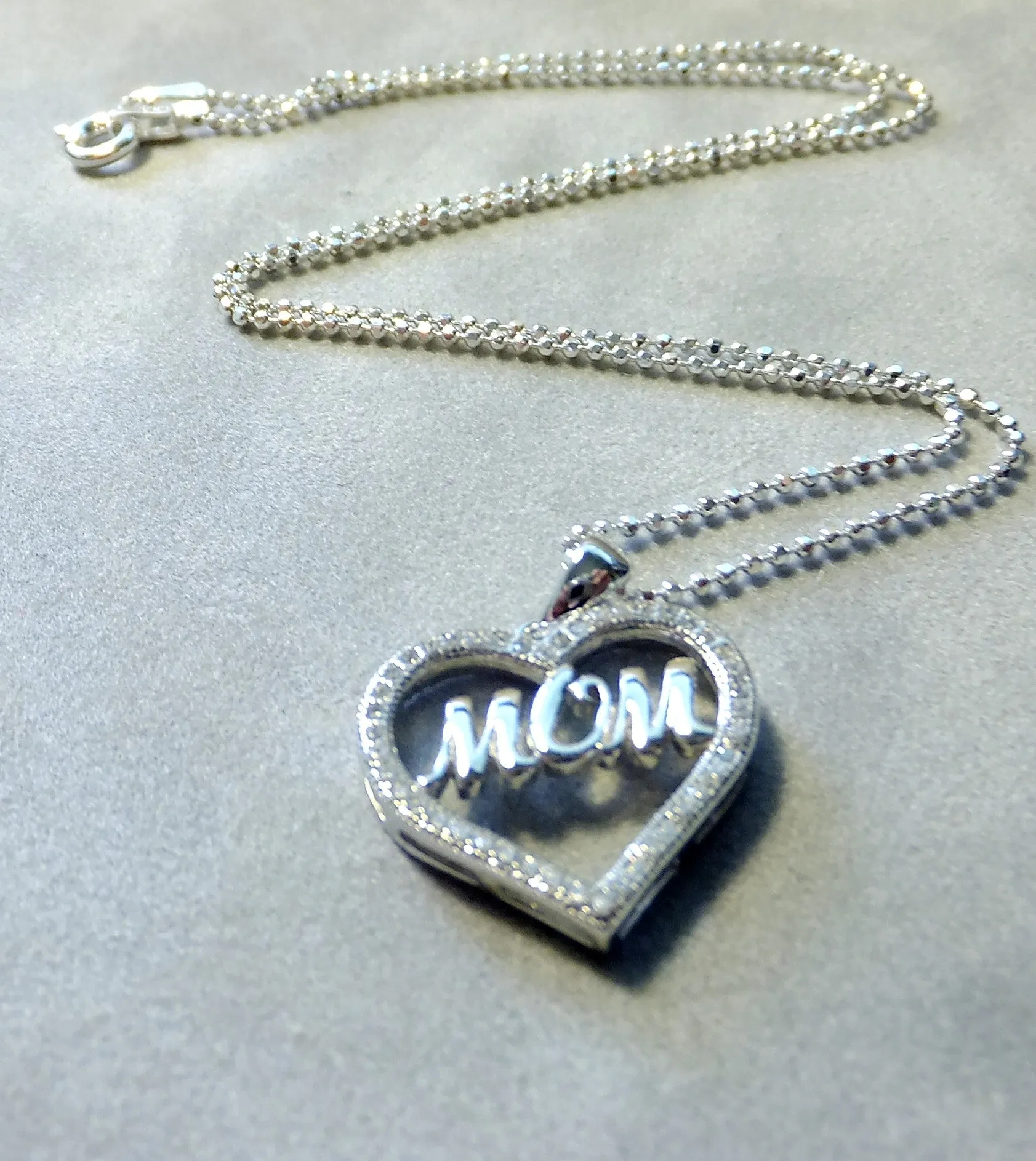 Heart Pendant Necklace That Says Mom in Sterling Silver